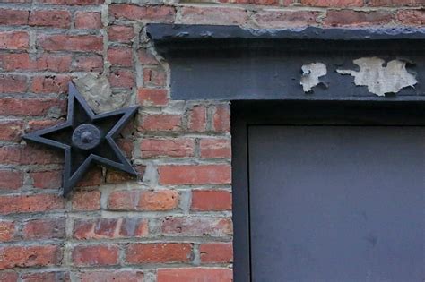 metal stars on old buildings